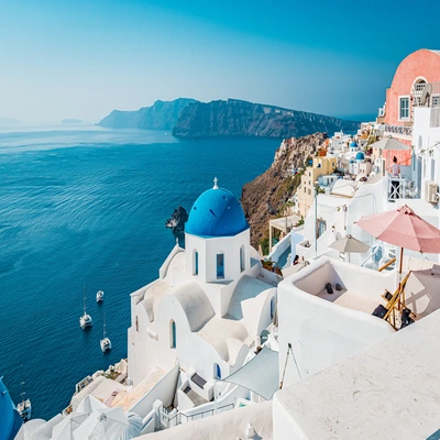 Greek islands with white buildings and blue sea